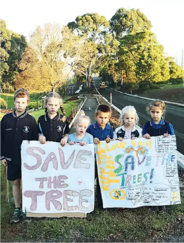  ??  ?? Children living around the Weebar Rd, Drouin area are lobbying to save the trees (from left) Lachlan, Jade and Paige Harris, Reb Kensley, Ruby Sharpe and Tilly Kensley.