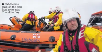  ??  ?? ● RNLI teams rescued the girls from rocks near Trearddur Bay