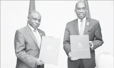  ??  ?? Minister of Foreign Affairs Carl Greenidge (left) with Minister of Foreign Affairs and Religious Affairs of Haiti Antonio Rodrigue after the signing of the MoU.