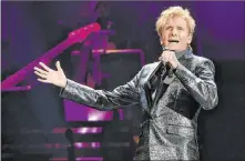  ?? Rob Grabowski The Associated Press ?? Barry Manilow is due to wrap up his run at New York’s Lunt-fontanne Theatre on Saturday. Manilow’s husband/manager, Garry Kief, slapped back at a New York Post account of disarray in the production.