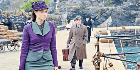  ?? VIGLASKY ROBERT ?? Vera Claythorne, played by Maeve Dermody, leads William Blore, played by Burn Gorman, and Charles Dance, as Judge Wargrave, on to Soldier Island to meet their fate