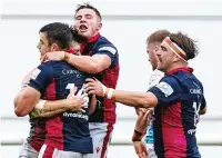  ??  ?? Joy: Scottish celebrate the Rob Stevenson try