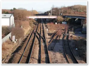  ?? GRAEME PICKERING. ?? The main Durham Coast route looking east from Pelaw, with Metro flyovers above the severed link to the former Leamside line turning to the right under them.