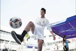  ?? Erik Verduzco ?? Las Vegas Review-journal @Erik_verduzco Yandel Aguilar, 12, of Las Vegas displays fancy footwork in an event Friday for the city’s new soccer team at Zappos corporate headquarte­rs.