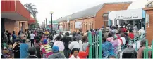  ?? Picture: ANTONIO MUCHAVE ?? ANGRY: VBS Mutual bank customers queue outside the bank demanding their money in June.