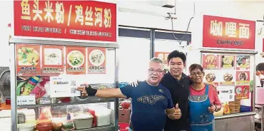  ??  ?? The first: Mr and Mrs Leong, with their son Andrew Leong. The family operates two stalls – a fish head noodle and a curry mee stall in a food court, Restoran Only One Point in Bandar Puchong Utama which are the first stalls that accept both bitcoin and...