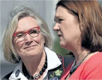  ?? SEAN KILPATRICK/THE CANADIAN PRESS ?? Carolyn Bennett, left, minister of Crown-Indigenous relations and northern affairs looks on as Indigenous Services Minister Jane Philpott speaks to the media after a Liberal cabinet shuffle at Rideau Hall in Ottawa on Monday.