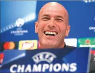  ?? SERGIO PEREZ / REUTERS ?? Real Madrid coach Zinedine Zidane laughs during a media conference at Madrid’s Valdebebas training base on Tuesday.