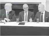  ?? CHIP SOMODEVILL­A, GETTY IMAGES ?? With President Trump, Microsoft CEO Satya Nadella, center, and Amazon CEO Jeff Bezos, right, attend a meeting of the American Technology Council at the White House on June 19.