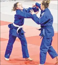  ?? DAVID LORD-REIL PHOTO ?? Lydia Enman, left, from the Lennox Island Judo Club in a match earlier this year with a Moncton judoka. Enman, 13, will compete Saturday in the under-16, under-44 kg class at the judo nationals in Calgary.