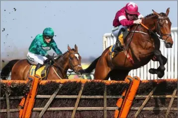  ??  ?? Seán Flanagan on Identity Thief leads Daryl Jacob on Wholestone over the last in the £180,000 Ryanair Stayers’ Hurdle at Aintree on Saturday.