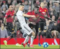  ??  ?? ON CENTRE STAGE: Pogba tussles with Ronaldo