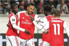  ?? — AFP ?? Arsenal’s Pierre-Emerick Aubameyang (second from left) celebrates after scoring against Eintracht Frankfurt in their Europa League Group F match on Thursday.