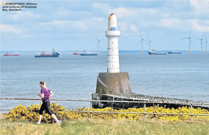  ??  ?? ATMOSPHERI­C: Offshore wind turbines off Greyhope Bay, Aberdeen