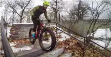  ?? ROBERT F. BUKATY/AP ?? Range Morton rides down a stairway on his fat tire bike at a park in Portland, Maine.