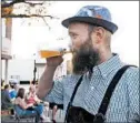  ?? MARK KODIAK UKENA/PIONEER PRESS ?? Ryan Tracy, owner of Beer on the Wall, takes a swig of German beer during Main Street Oktoberfes­t in Park Ridge in 2017.