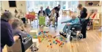  ??  ?? Game on: care home residents playing Hungry Hippos