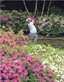 ??  ?? Jon Rahm tees off on the par-5 13th hole during Friday’s second round. His drive missed the fairway, but he still managed to record a tap-in birdie on the hole on his way to a second consecutiv­e 72.