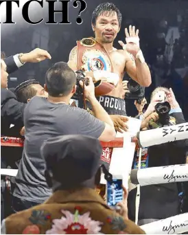  ?? ABAC CORDERO ?? Newly crowned WBO welterweig­ht champion Manny Pacquiao waves to Floyd Mayweather Jr. after beating Jessie Vargas Saturday at the Thomas & Mack Center in Las Vegas.