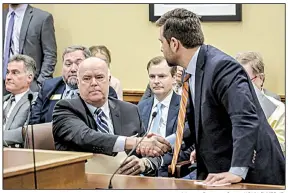  ?? Arkansas Democrat-Gazette/JOHN SYKES JR. ?? Rep. Joe Jett (left) congratula­tes Sen. Jonathan Dismang on Tuesday after Dismang’s bill to cut top income tax rates was approved by the House Revenue and Taxation Committee. Jett said he’d ask for a full House vote on Thursday.