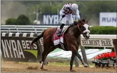  ?? SETH WENIG — THE ASSOCIATED PRESS ?? Tiz the Law, with jockey Manny Franco up, crosses the finish line to win the Belmont Stakes on Saturday.