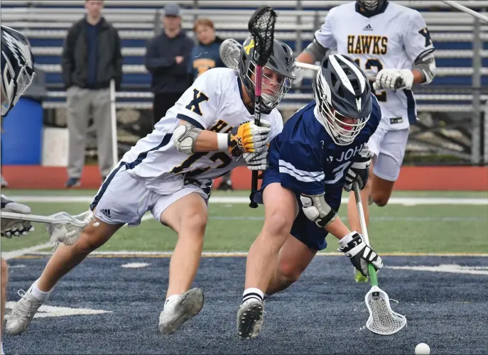  ?? CHRIS CHRISTO / HERALD STAFF ?? SUPER SCOOPER: Xaverian’s Hunter Molway pursues St. John’s Prep’s Chris Esposito during the Eagles’ 12 -4 win on Tuesday.