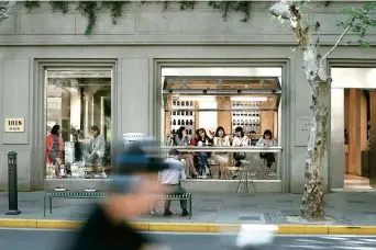  ??  ?? The indoor space and outdoor seats of the coffee shop on the century-old Yuyuan Road are always filled, if weather permits. — All photos/Ti Gong