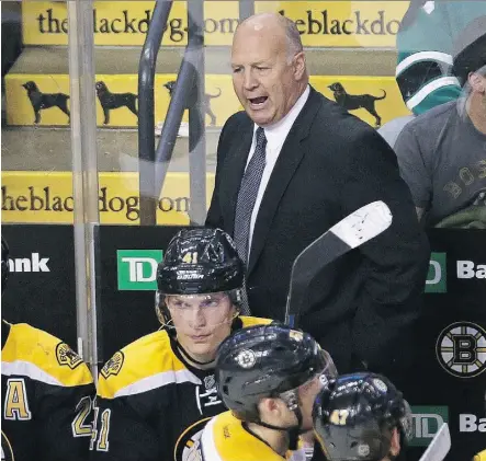  ?? CHARLES KRUPA/THE ASSOCIATED PRESS ?? Boston Bruins head coach Claude Julien tries to rally his players in early NHL action. With the Bruins off to an 0-30 start, Julien’s job appears to be in jeopardy.