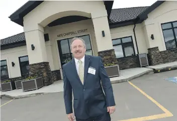  ?? DON HEALY ?? RM of Sherwood Deputy Reeve Tim Probe stands in front of the new RM offices located at 4440 Campbell Street in Harbour Landing. The land for the building was obtained by a tax arrears forfeit to the RM.