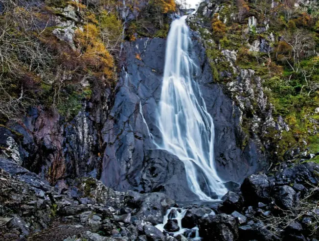  ??  ?? Aber Falls in Gwynedd, North Wales, dives down rock to form a horsetail waterfall that is almost feathery in its appearance.