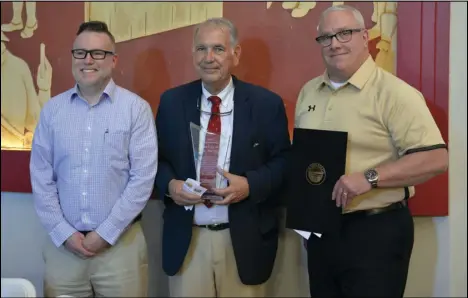  ?? Staff photo/Skyler Mitchell ?? Manager of Industrial and Community Developmen­t Mike Burkholder, Assistant Law Director Kraig Noble and Public Service and Safety Director Greg Foxhoven stand for a photo Thursday evening following the city of St. Marys receiving the Stahr Award at the Greater Grand Lake Region Visitors Center annual awards reception.