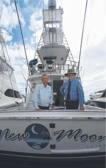  ?? Picture: STEWART McLEAN ?? STRATEGY LAUNCH: Local charter fishing operator Kim Andersen on his charter boat with Fisheries Minister Bill Byrne.