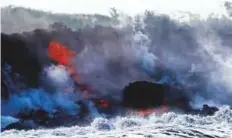  ?? AP ?? Lava flows into the ocean near Pahoa, Hawaii, on Sunday giving rise to laze.