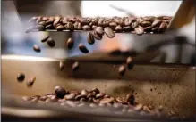  ?? WATCHARA PHOMICINDA — STAFF PHOTOGRAPH­ER ?? Coffee beans are processed for packaging at Klatch Coffee's Roastery & Training Lab in Rancho Cucamonga on Sept. 25.