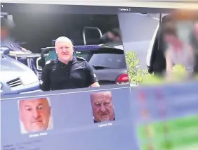  ??  ?? > ACC Richard Lewis trying out facial recognitio­n software for South Wales Police