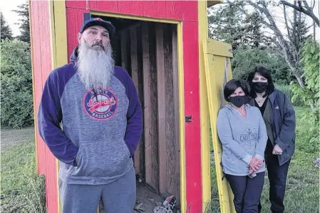  ?? JEREMY FRASER • CAPE BRETON POST ?? Sydney and District Little League board members stand in front of an equipment shed located at McCormick Ball Field off Cabot Street in Sydney on Sunday. Executive members discovered Sunday the shed had been broken into and gear stolen. From left are Scott Lecky, Michelle Ferguson and Bev Haggett.