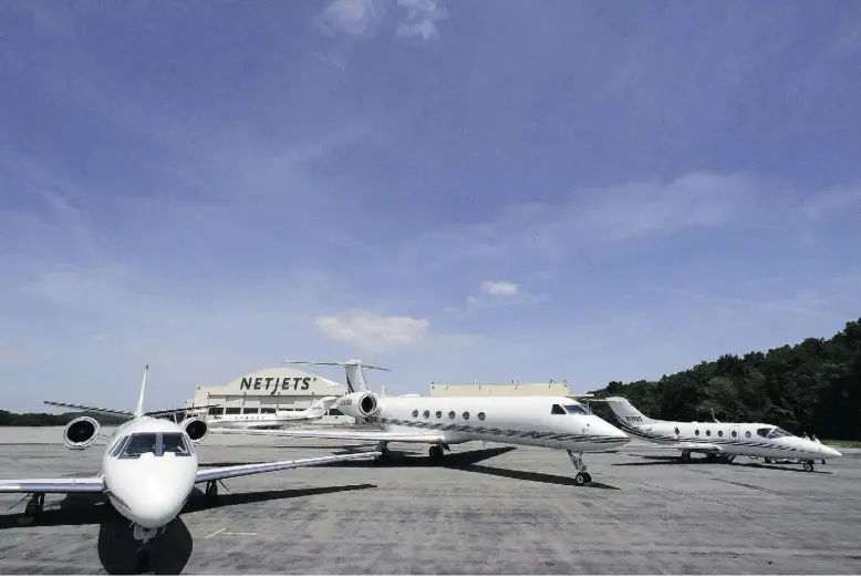  ?? Librado Romero / The New Yo rk Times ?? NetJets planes are parked at the Westcheste­r County Airport in Westcheste­r, N.Y. “We’re seeing opportunit­ies in that upper end of the market coming on very strong,” Chuck Suma, NetJets’ executive vice-president for global asset management and procuremen­t, says. “Travel patterns for business aviation are changing … There is a growing need for large-cabin, long-range aircraft and we continue to assess the market niche for that and what our future may be in that area.”