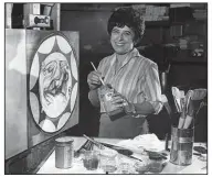  ?? (Chicago Tribune/TNS) ?? Artist Martyl Langsdorf, posing in her studio in 1967, recalled experiment­ing with different images to convey the dangers of the atom bomb. “The most significan­t of all was a sketch of a clock, which I made on the 8-by-11-inch back of a bound copy of Beethoven’s Piano Sonatas,” she said. “A clock in white paint on the black binding of the Sonatas.”