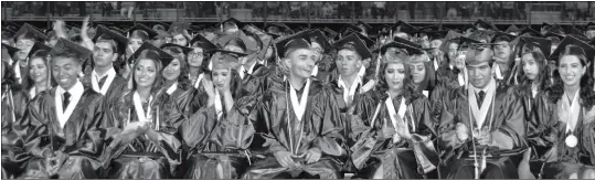  ?? Buy this photo at YumaSun.com FILE PHOTO BY CESAR NEYOY/BAJO EL SOL ?? A VIEW OF SAN LUIS HIGH SCHOOL GRADUATES JUST BEFORE THEY RECEIVED THEIR DIPLOMAS during the commenceme­nt ceremony at the school’s football field in May.