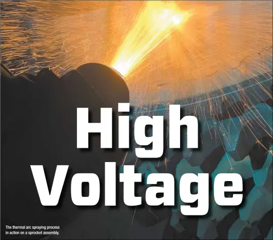 ??  ?? The thermal arc spraying process in action on a sprocket assembly.