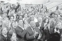  ??  ?? Alli Webb, Mark Cuban, Daymond John, and Kevin O'Leary, all members of the television show Shark Tank, pose with students from Olympic Heights High School in Boca Raton, Monday.