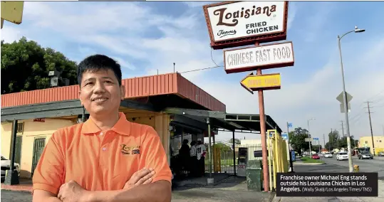  ?? (Wally Skalij/Los Angeles Times/TNS) ?? Franchise owner Michael Eng stands outside his Louisiana Chicken in Los Angeles.