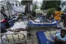  ?? Country. Photograph: Fernando Llano/AP ?? The injured lie in beds outside the Immaculée Conception hospital in Les Cayes, Haiti, two days after a 7.2-magnitude earthquake struck the south-western part of the