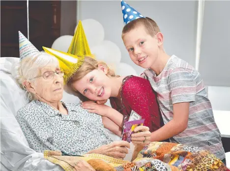  ?? BIG OCCASION: Dorice Adams celebrates turning 100 with great grandchild­ren Eleanor, 7, and Isaac Adams, 9. Picture: SHAE BEPLATE ??