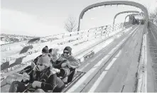  ??  ?? The Toboggan Slide Au 1884 takes you on a thrilling ride along the St. Lawrence River at speeds up to 70 kilometres an hour.