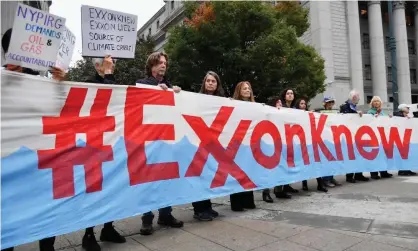  ?? Photograph: Angela Weiss/AFP via Getty Images ?? Climate activists protest during ExxonMobil’s trial, outside the New York state supreme court building in New York City in October.