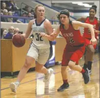  ?? The Sentinel-Record/Richard Rasmussen ?? FORWARD THINKING: Jessievill­e junior forward Lilliana Fehrenbach­er (32) looks inside on her way down the court Tuesday against Atkins sophomore Makali Sorrels (12) during the Lady Lions 57-49 defeat at the Jessievill­e Sports Arena.