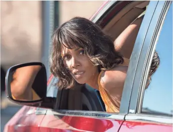  ?? PHOTOS BY PETER IOVINO, RELATIVITY MEDIA ?? Halle Berry’s plucky Karla pulls some serious highway moves: “Driving backward in highway traffic, that was a first for me,” the actress says. “Your heart leaves your body.”