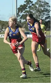  ?? ?? Georgia Keeble moves through the midfield as she’s shepherded by Charlize Dent.