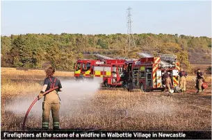  ?? ?? Firefighte­rs at the scene of a wildfire in Walbottle Village in Newcastle